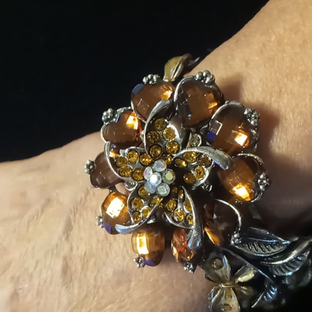 Amber color crystal flower clamper bracelet. Spring Hinged statement